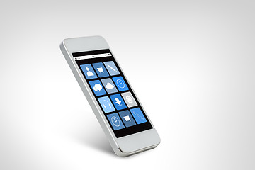 Image showing white smarthphone with application icons on screen