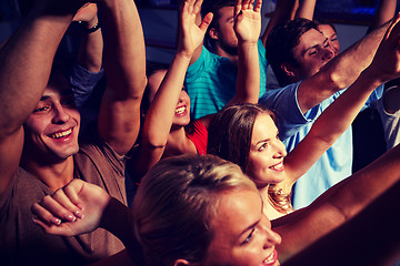 Image showing group of smiling friends at concert in club