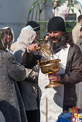 Image showing Priest blessing people with holy water. Tyumen