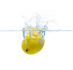 Image showing lemon falling or dipping in water with splash