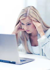 Image showing stressed woman with laptop