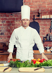 Image showing happy male chef cook with vegetables in kitchen