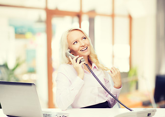 Image showing smiling businesswoman or student calling on phone