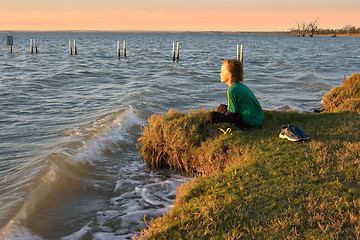 Image showing boy looking over lake