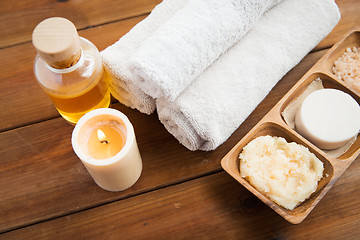 Image showing close up of natural cosmetics and bath towels