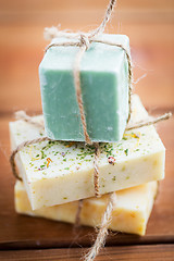 Image showing close up of handmade soap bars on wood