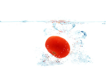 Image showing tomato falling or dipping in water with splash