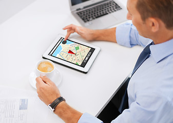 Image showing businessman with tablet pc and coffee in office