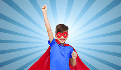 Image showing boy in red super hero cape and mask showing fists