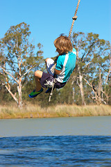 Image showing boy swinging
