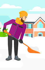 Image showing Man shoveling and removing snow.