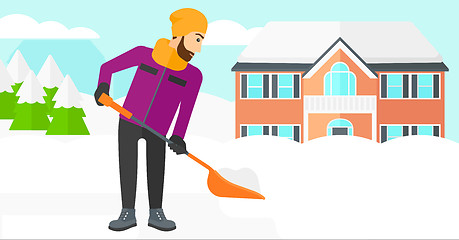 Image showing Man shoveling and removing snow.