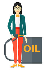 Image showing Woman with oil can and filling nozzle.