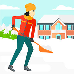 Image showing Woman shoveling and removing snow.