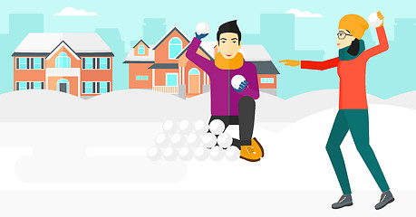 Image showing Couple playing in snowballs.
