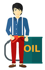Image showing Man with oil can and filling nozzle.