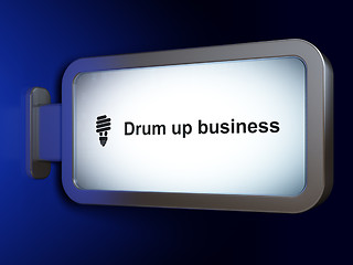 Image showing Business concept: Drum up business and Energy Saving Lamp on billboard background