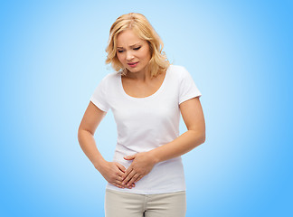 Image showing unhappy woman suffering from stomach ache