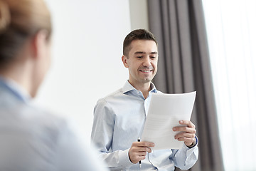 Image showing smiling business people meeting in office