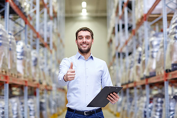 Image showing happy man at warehouse showing thumbs up gesture