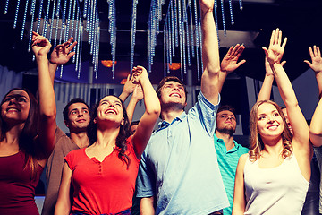 Image showing group of smiling friends at concert in club