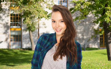 Image showing happy teenage student girl over campus 