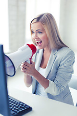 Image showing crazy businesswoman shouting in megaphone