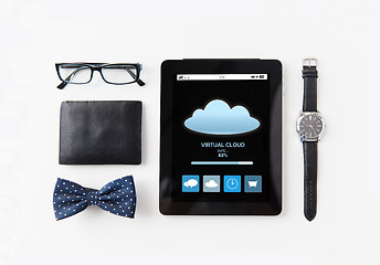Image showing tablet pc with cloud computing and personal stuff