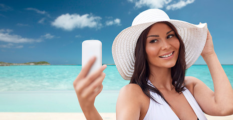 Image showing young woman taking selfie with smartphone