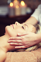 Image showing close up of woman having face massage in spa