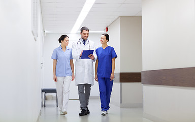 Image showing group of medics at hospital with clipboard