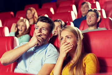 Image showing happy friends watching horror movie in theater