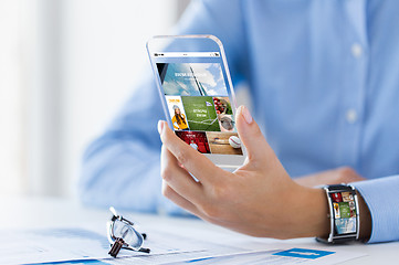 Image showing close up of woman with application on smartphone