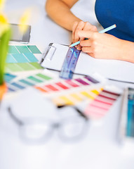 Image showing woman working with color samples for selection