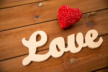 Image showing close up of word love with red heart decoration