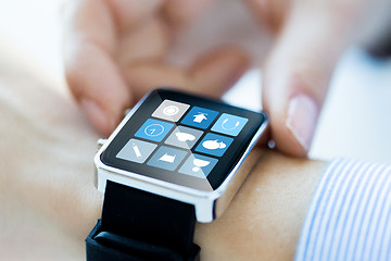 Image showing close up of hands setting smart watch application