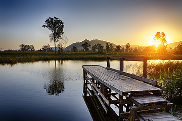 Image showing Serene Sunrise over fishing Jetty