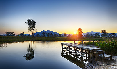 Image showing Serene Sunrise over fishing Jetty