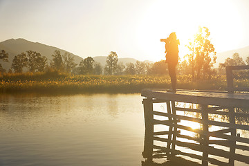 Image showing Young photographer is taking photos