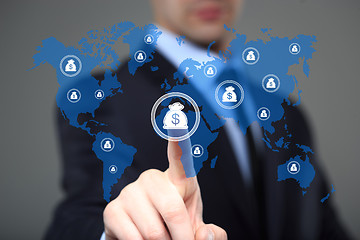 Image showing Businessman pushing button with dollar map currency web icon. business, technology and internet concept 