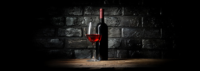 Image showing Wine and black wall