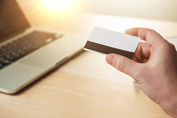 Image showing The man doing online shopping with credit card 