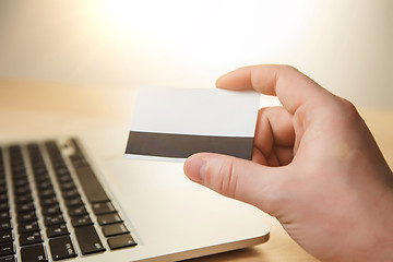 Image showing The man doing online shopping with credit card 