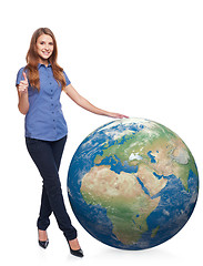 Image showing Woman in full length with earth globe