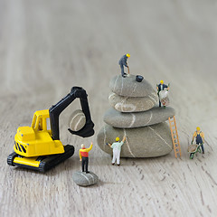 Image showing Construction site with miniature workers