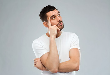 Image showing man thinking over gray background