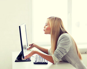 Image showing woman sending kisses with computer monitor