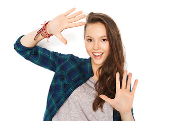 Image showing happy smiling pretty teenage girl showing hands