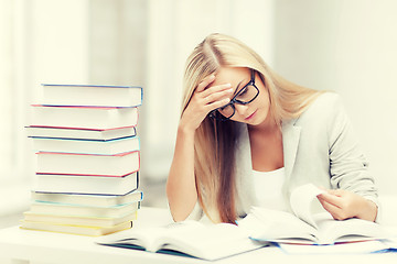 Image showing student with books and notes