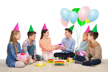 Image showing happy children giving presents at birthday party